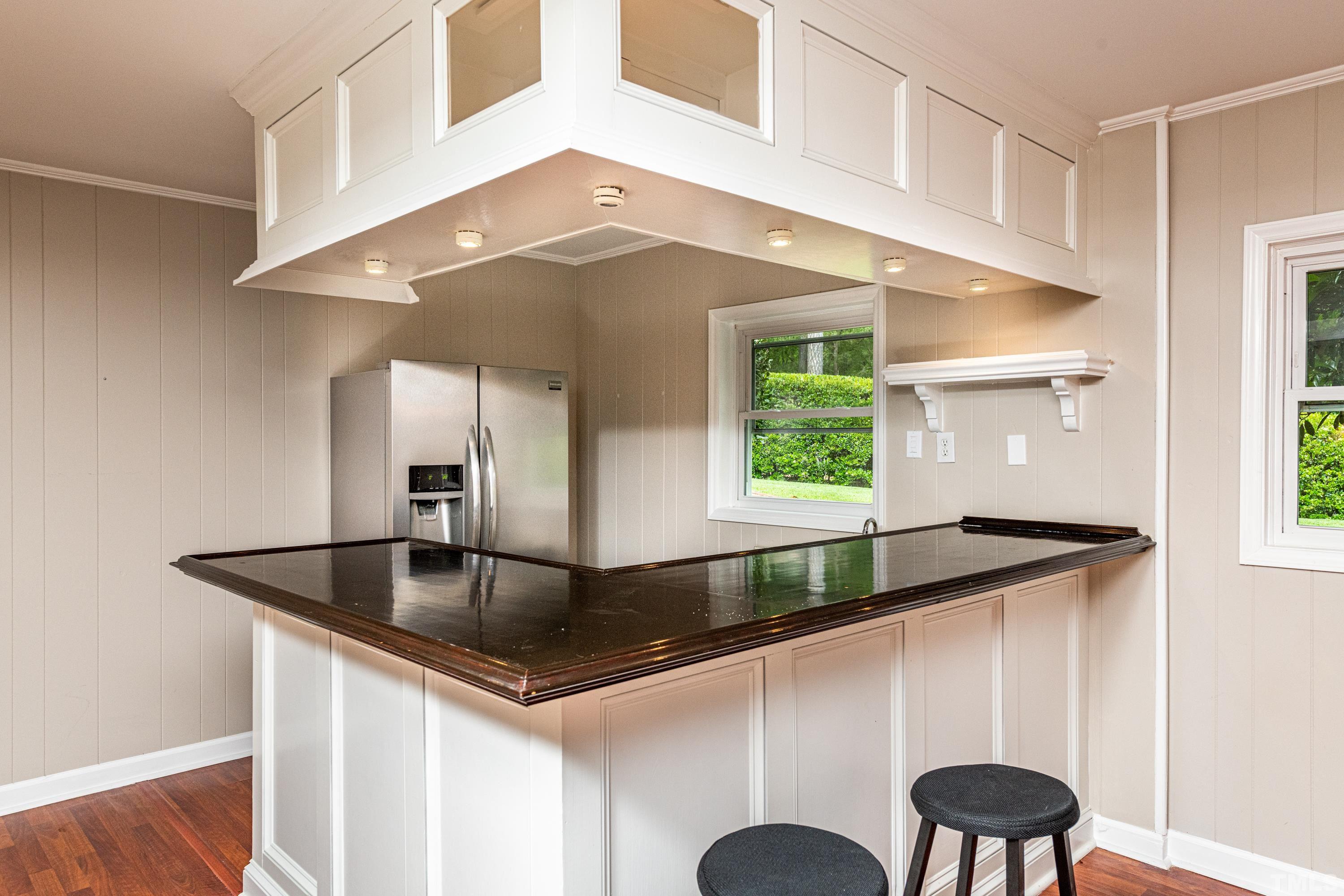 201 Chatterson Drive Raleigh, NC 27615 - Photo 30 of 44 a kitchen with a table and chairs
