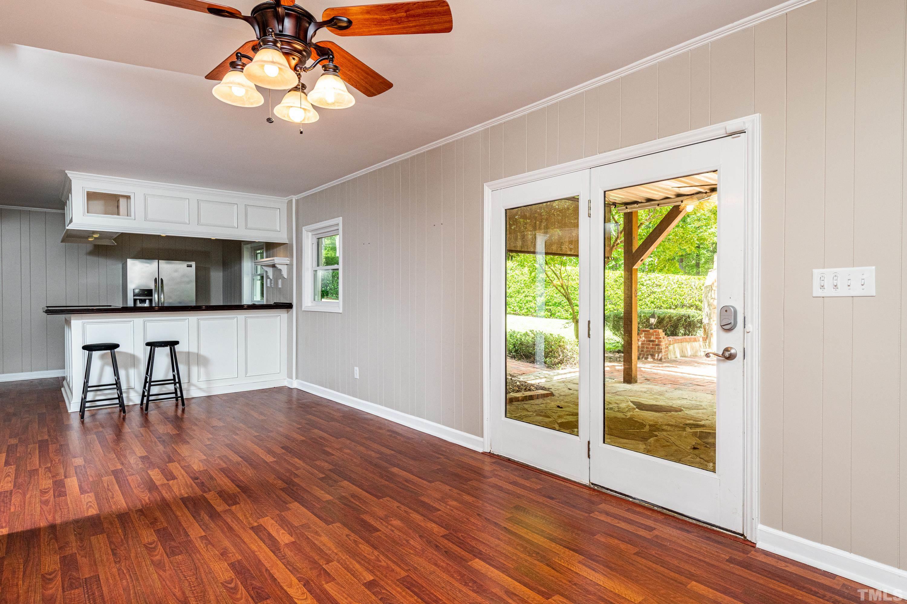 201 Chatterson Drive Raleigh, NC 27615 - Photo 32 of 44 a view of a livingroom with wooden floor and a ceiling fan