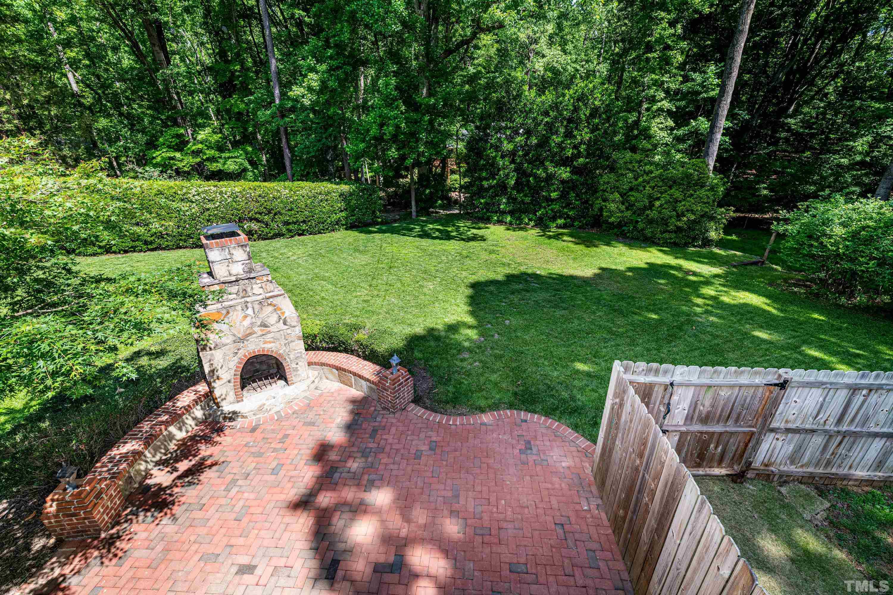 201 Chatterson Drive Raleigh, NC 27615 - Photo 37 of 44 a view of a garden with large trees