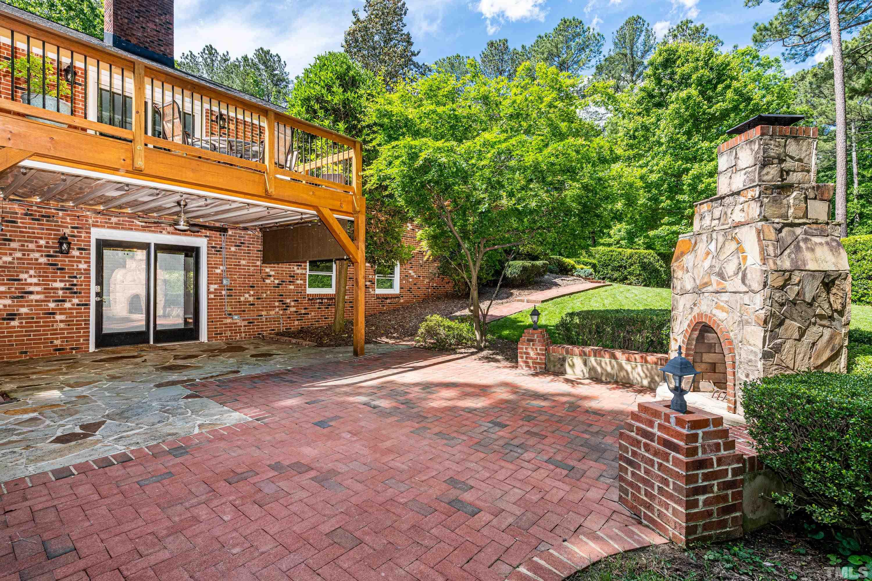 201 Chatterson Drive Raleigh, NC 27615 - Photo 39 of 44 a backyard of a house with a garden and outdoor seating