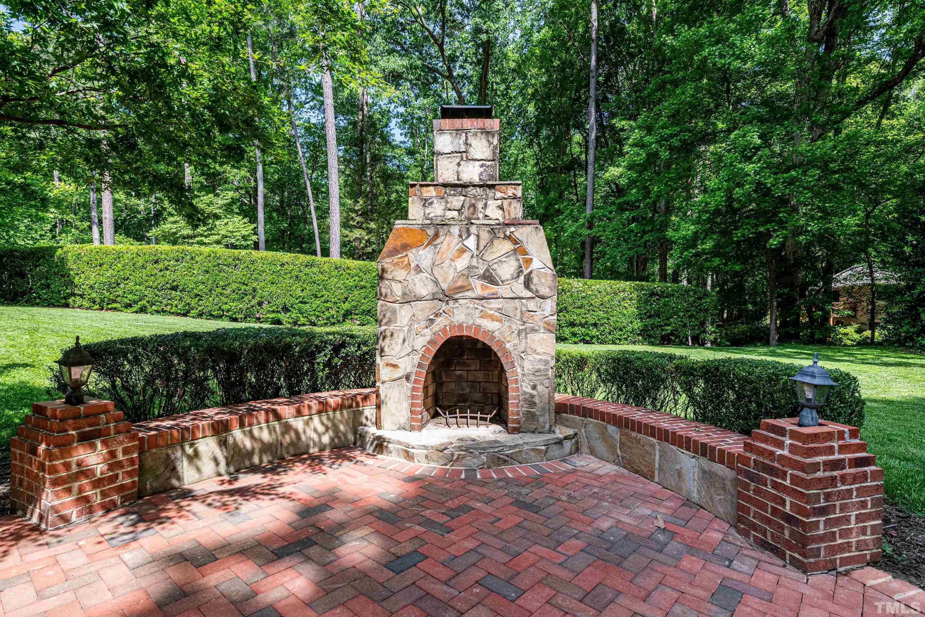 201 Chatterson Drive Raleigh, NC 27615 - Photo 40 of 44 a view of a garden with a bench in the garden