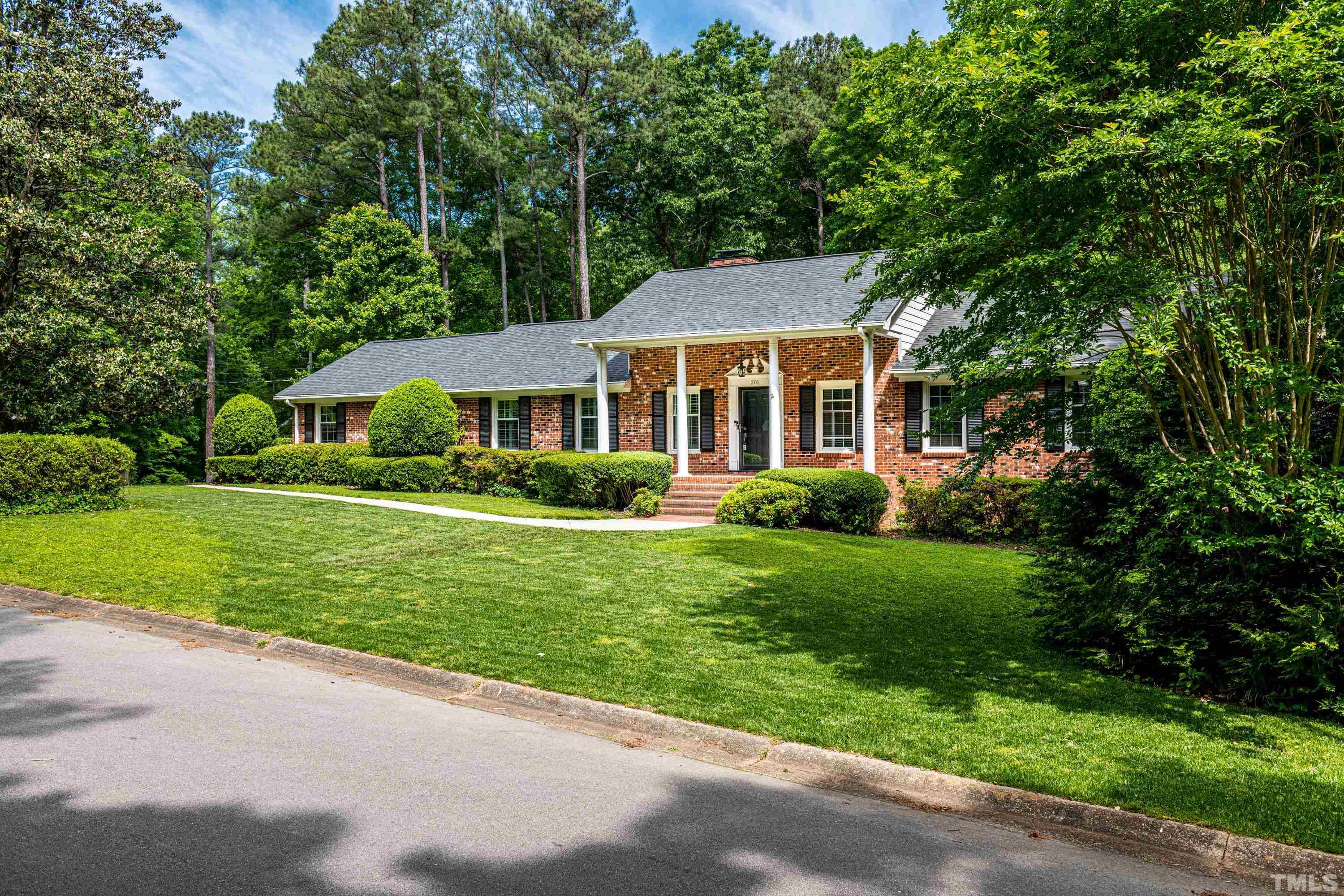 201 Chatterson Drive Raleigh, NC 27615 - Photo 43 of 44 a front view of a house with a yard