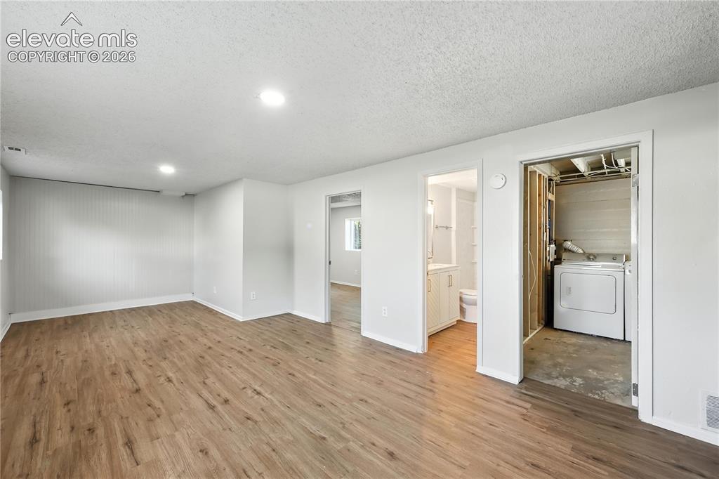 7033 Sequoyah Way Colorado Springs, CO 80915 - Photo 17 of 20 a view of empty room with wooden floor