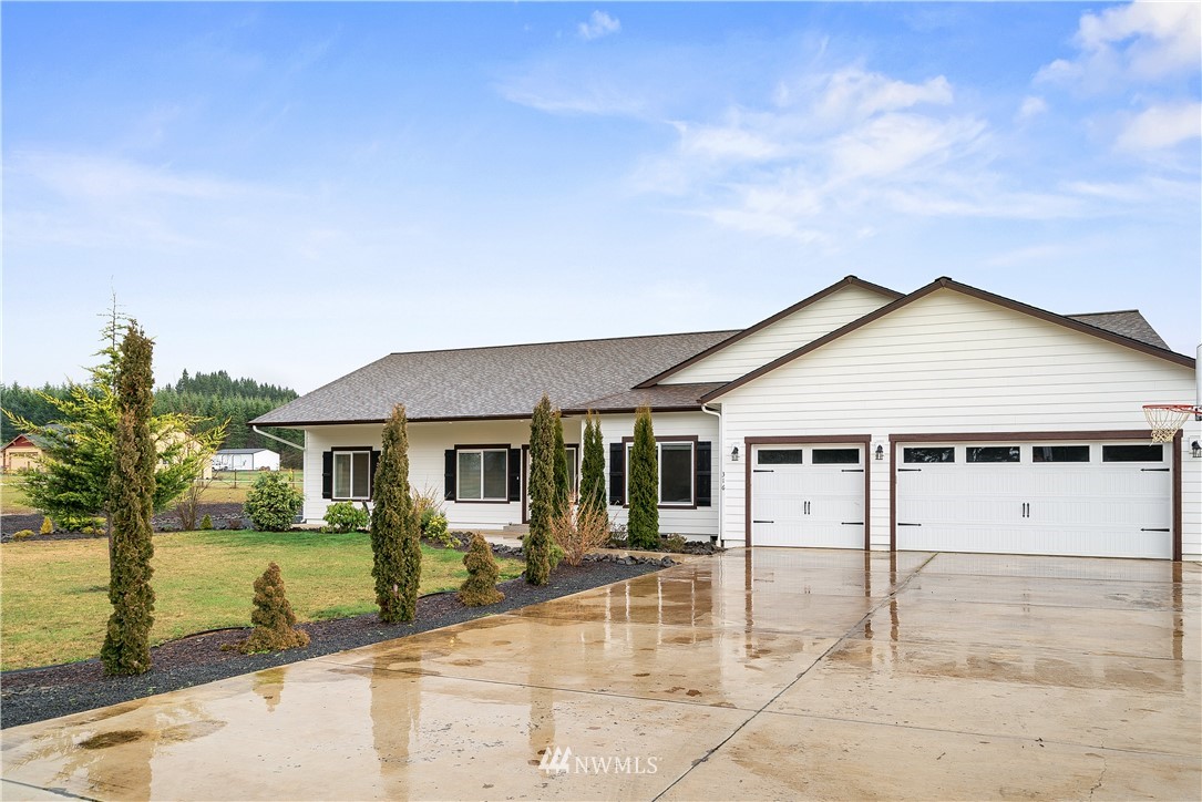 316 Pleasant Hill Road Chehalis, WA 98532 - Photo 2 of 30 a view of a white house with large windows