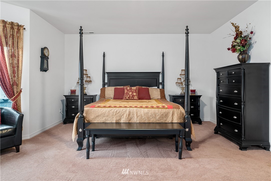 316 Pleasant Hill Road Chehalis, WA 98532 - Photo 16 of 30 a bedroom with a bed a dresser and a couch