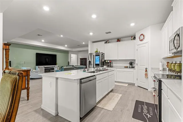 a view of a dining room with furniture and a window