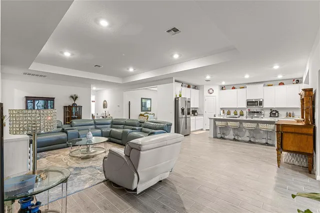 a bedroom with bed and wooden floor