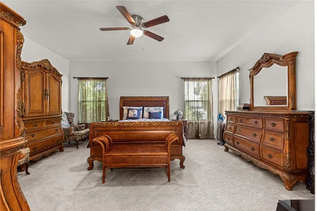 a bedroom with a bed and flat screen tv
