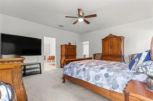 a room with furniture a flat screen tv and a window