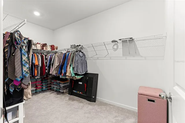 a bedroom with a bed a desk and chair