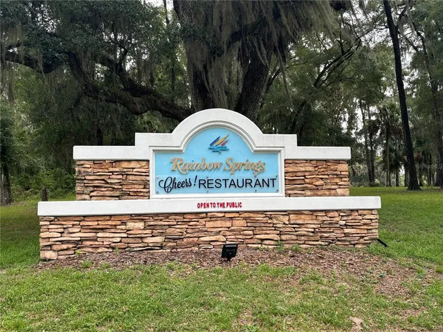 a view of swimming pool with a patio and a yard