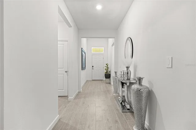 a view of a livingroom with furniture and stairs