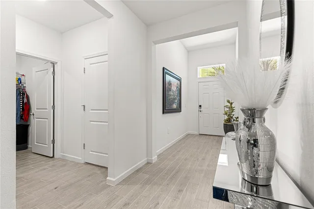 an entryway at livingroom with furniture and wooden floor