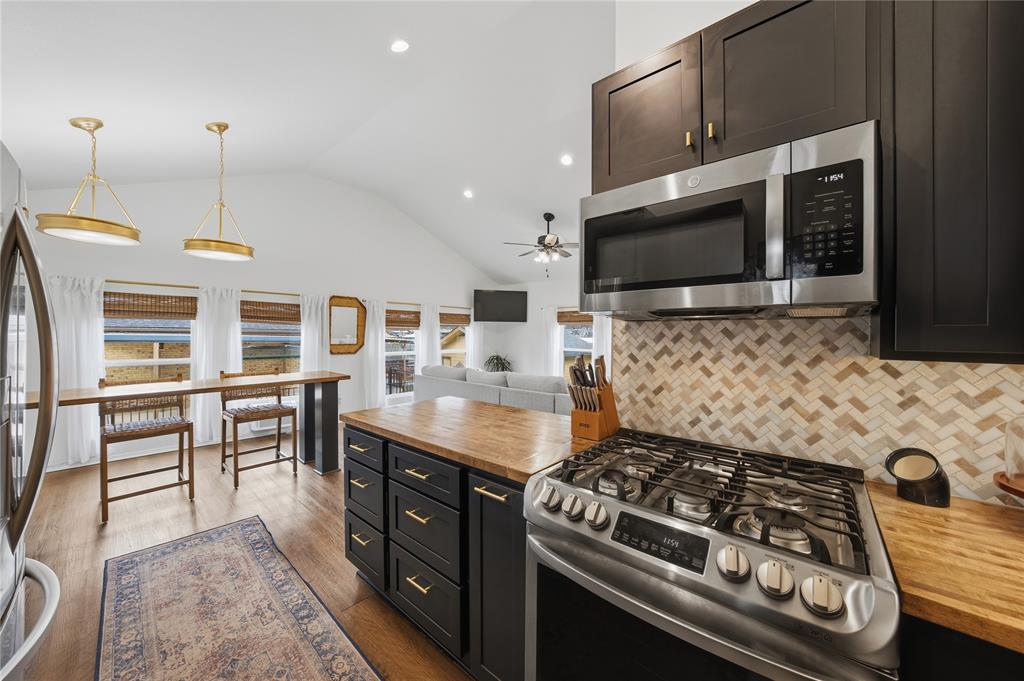 126 Maples Trail Mabank, TX 75156 - Photo 8 of 21 a kitchen with a stove and a microwave
