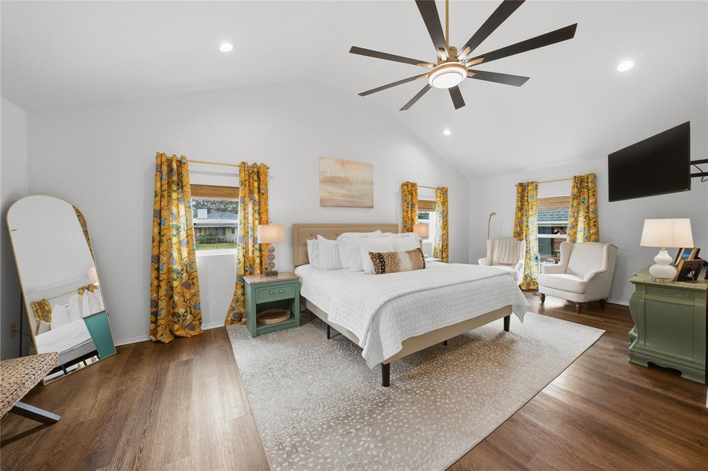 126 Maples Trail Mabank, TX 75156 - Photo 10 of 23 a bed room with furniture and a flat screen tv