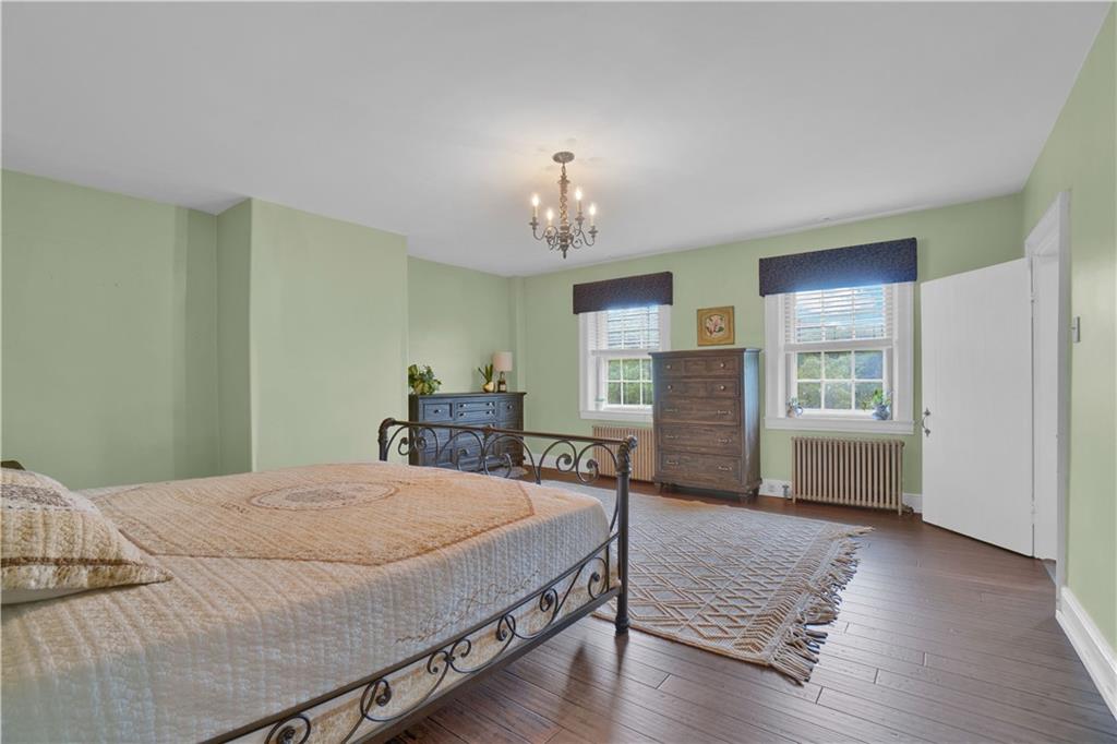 2560 Chapel Road Beaver, PA 15009 - Photo 16 of 25 a bedroom with a bed and a dresser with wooden floor