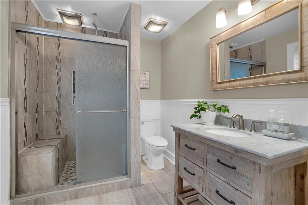 2560 Chapel Road Beaver, PA 15009 - Photo 21 of 25 a bathroom with a granite countertop sink toilet and shower