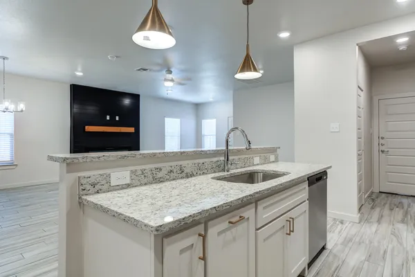 a kitchen with a stove and a sink