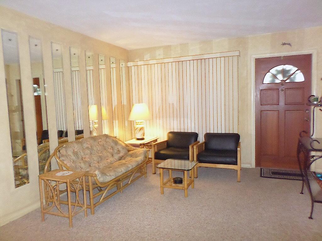 344 Mid Pines Road Palm Springs, FL 33461 - Photo 3 of 20 a spacious bedroom with a bed and a table chair