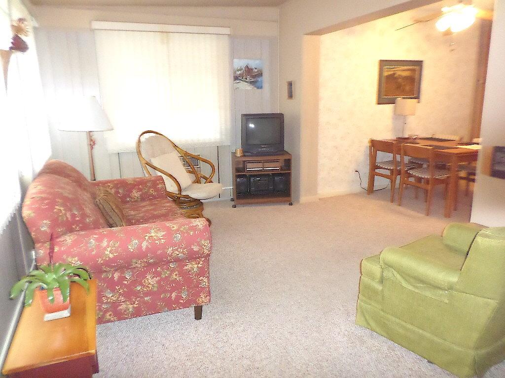 344 Mid Pines Road Palm Springs, FL 33461 - Photo 9 of 20 a living room with furniture and a flat screen tv