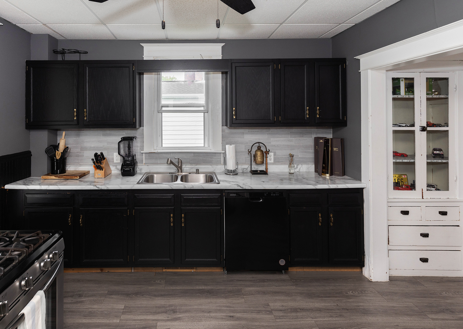 1839 15th Street Moline, IL 61265 - Photo 22 of 32 a kitchen with a sink and cabinets