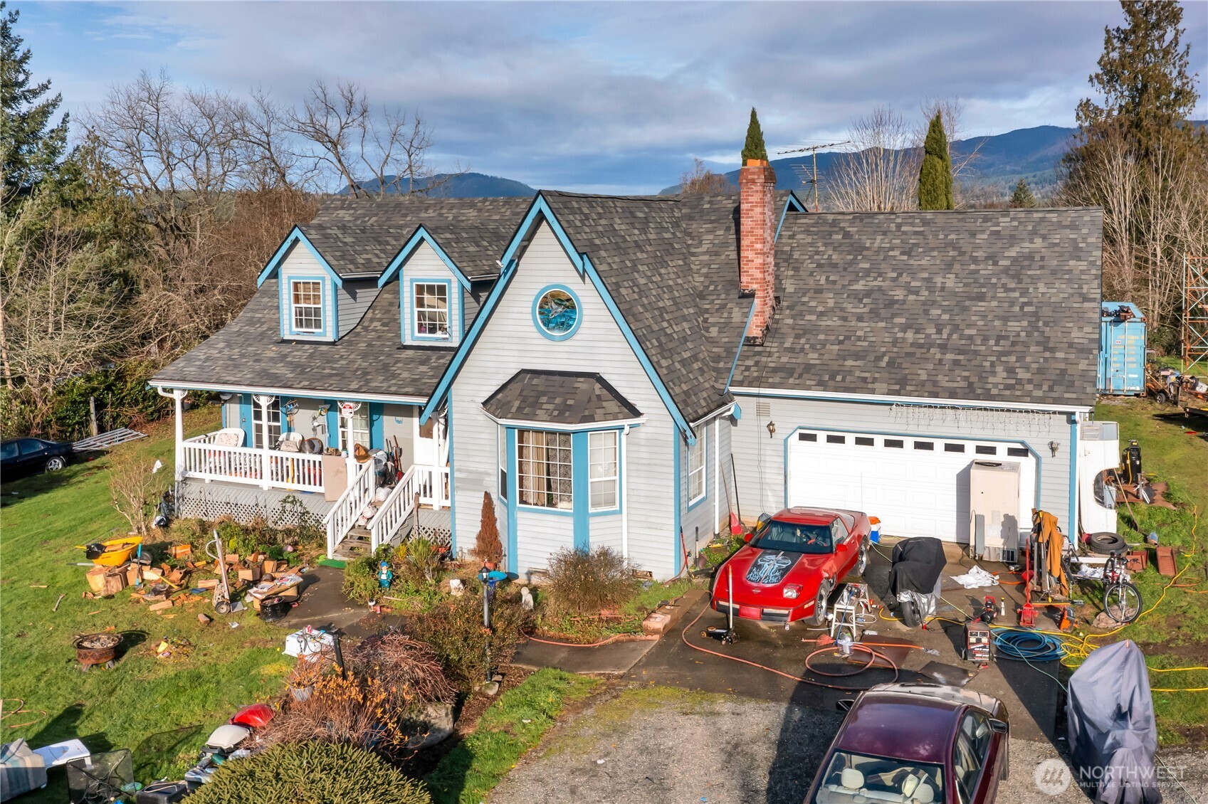26836 Southeast 208th Street Maple Valley, WA 98038 - Photo 13 of 37 a front view of a house with outdoor seating