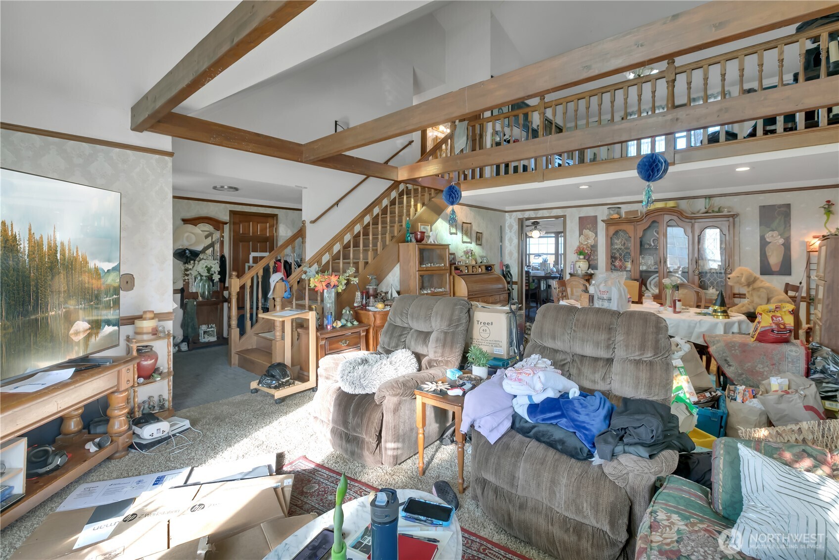 26836 Southeast 208th Street Maple Valley, WA 98038 - Photo 14 of 37 a living room with furniture and a flat screen tv