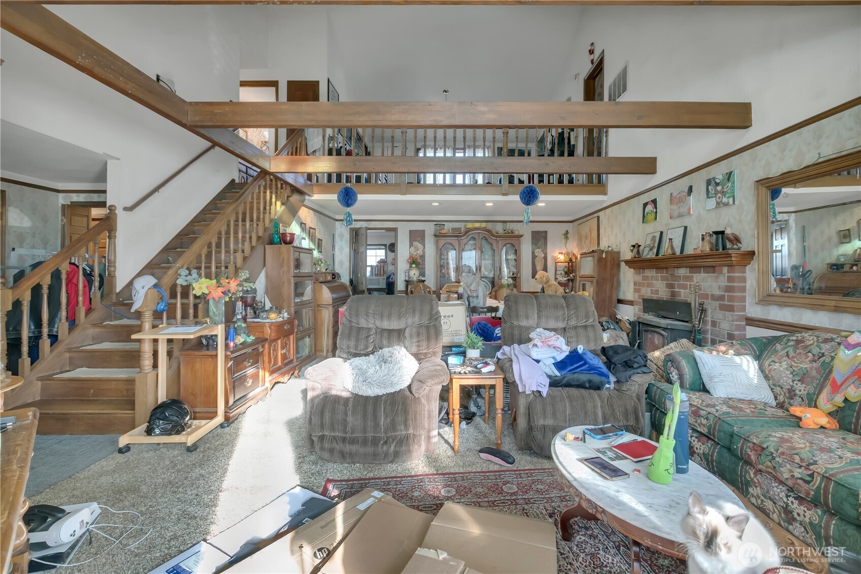 26836 Southeast 208th Street Maple Valley, WA 98038 - Photo 16 of 37 a living room with lots of furniture and a chandelier
