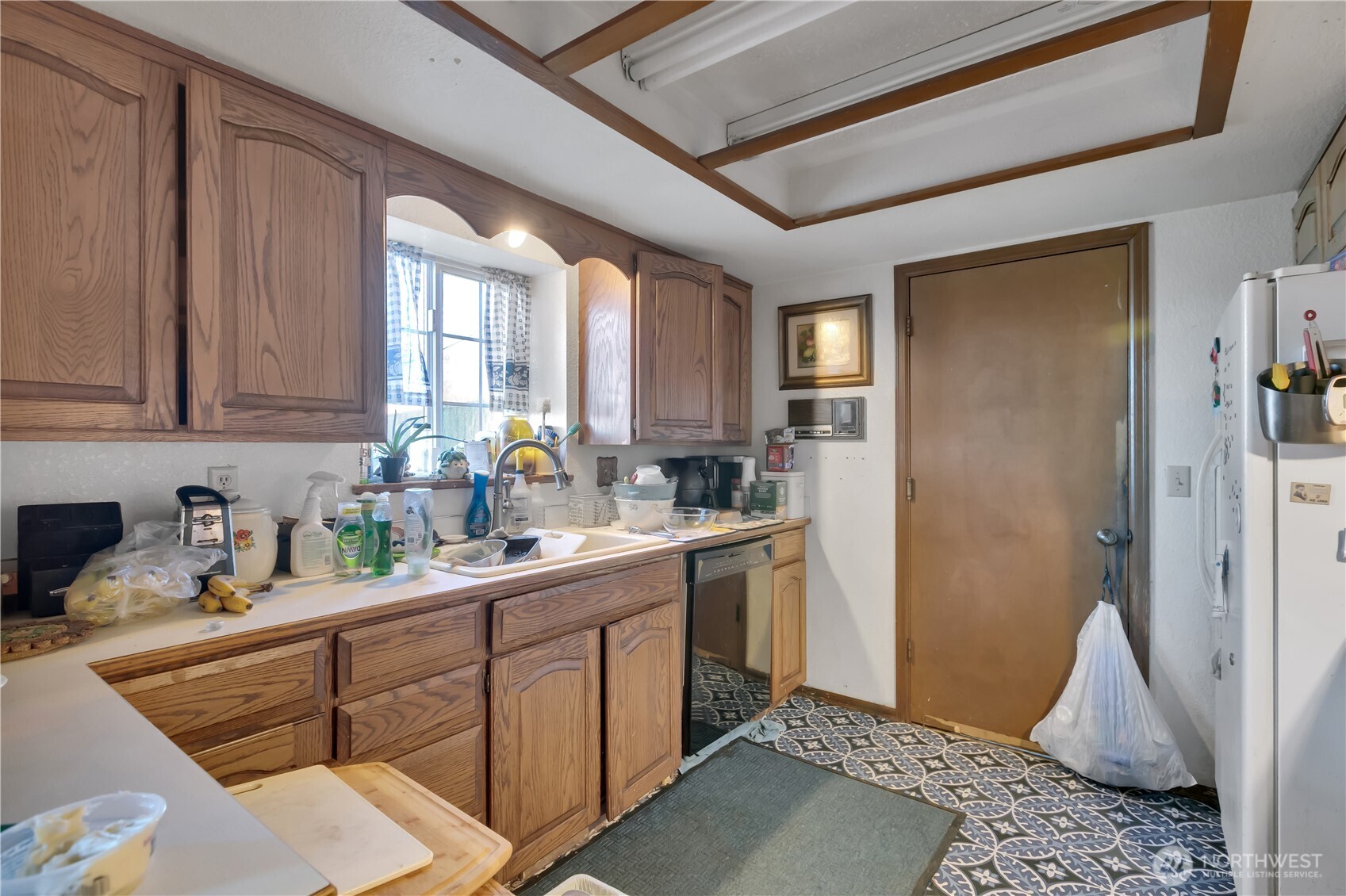 26836 Southeast 208th Street Maple Valley, WA 98038 - Photo 23 of 37 a kitchen with sink cabinets and window