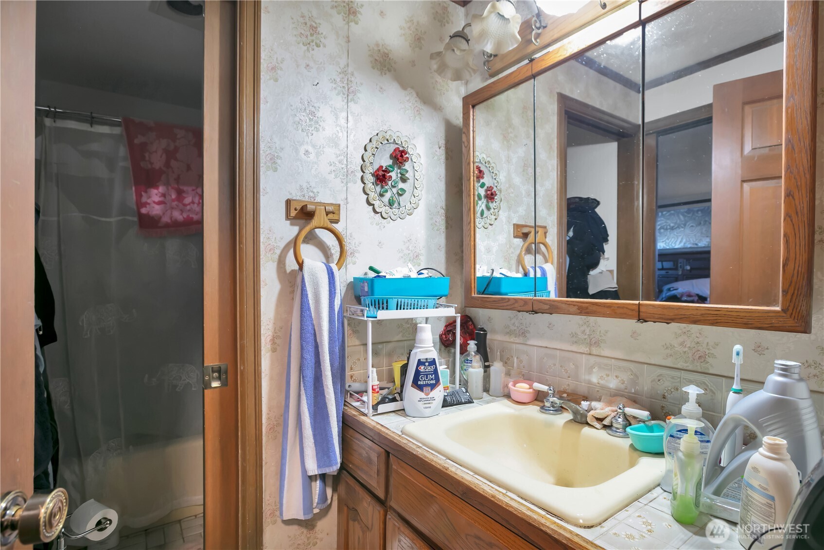 26836 Southeast 208th Street Maple Valley, WA 98038 - Photo 26 of 37 a bathroom with a sink mirror and shower