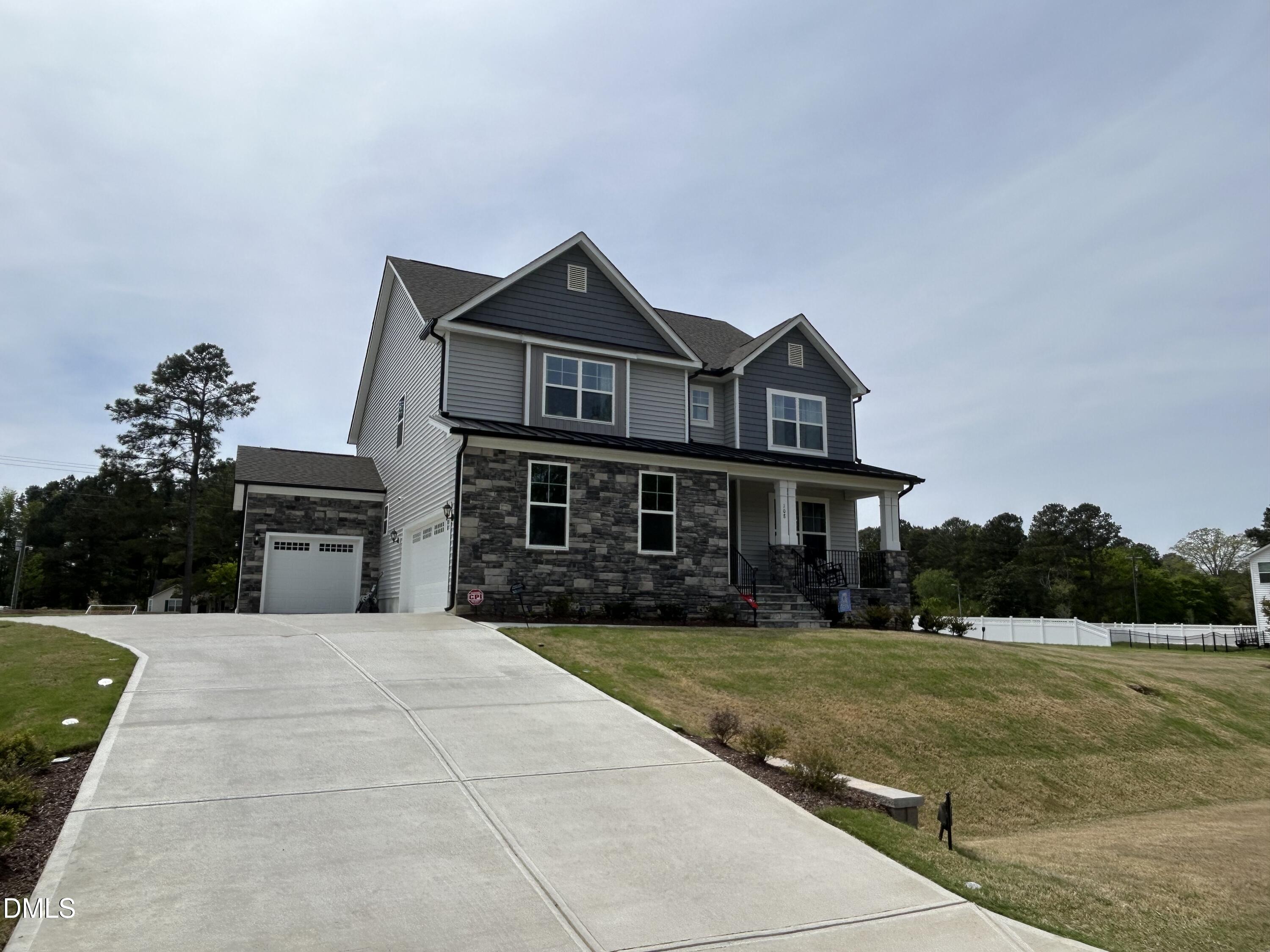 108 Rising Star Drive Clayton, NC 27520 - Photo 2 of 5 a front view of a house with yard