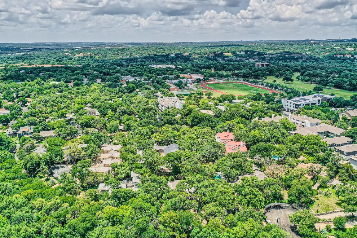 2501 Inwood Place Austin, TX 78703 - Photo 11 of 18 a view of a big yard with lots of green space and house in back