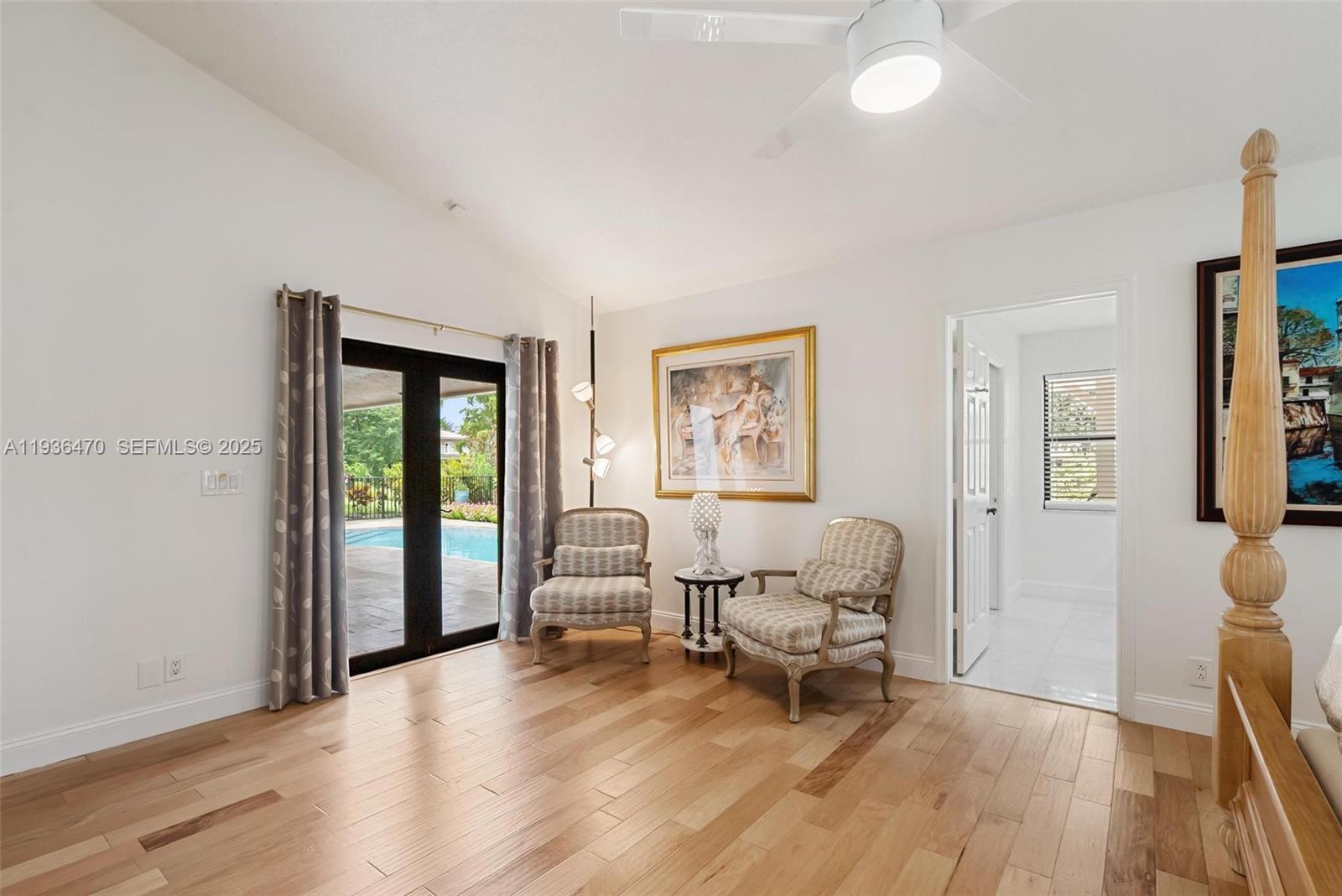 2685 Northwest 27th Terrace Boca Raton, FL 33434 - Photo 12 of 31 a living room with furniture and a wooden floor