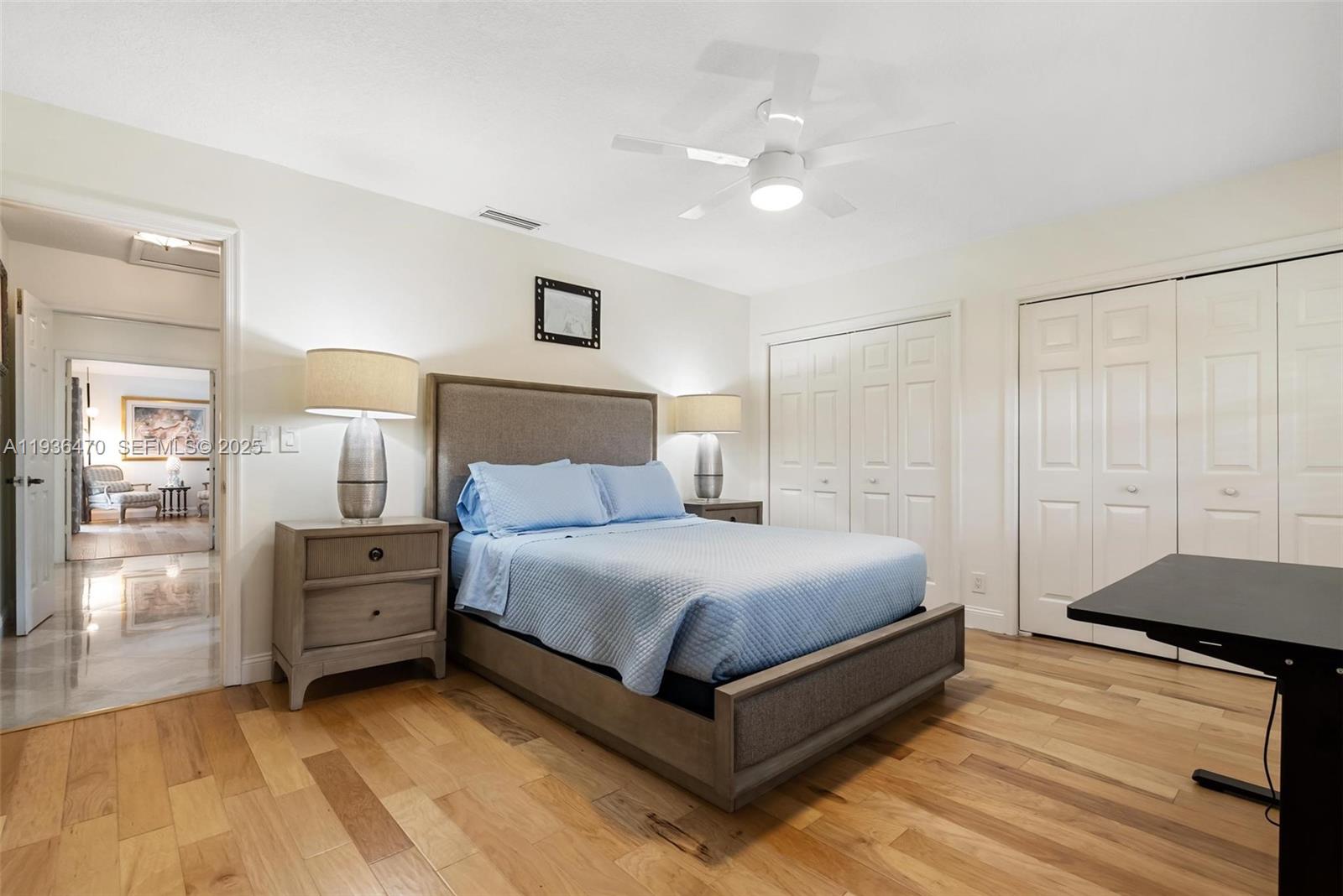 2685 Northwest 27th Terrace Boca Raton, FL 33434 - Photo 15 of 31 a bedroom with a bed and a cabinets