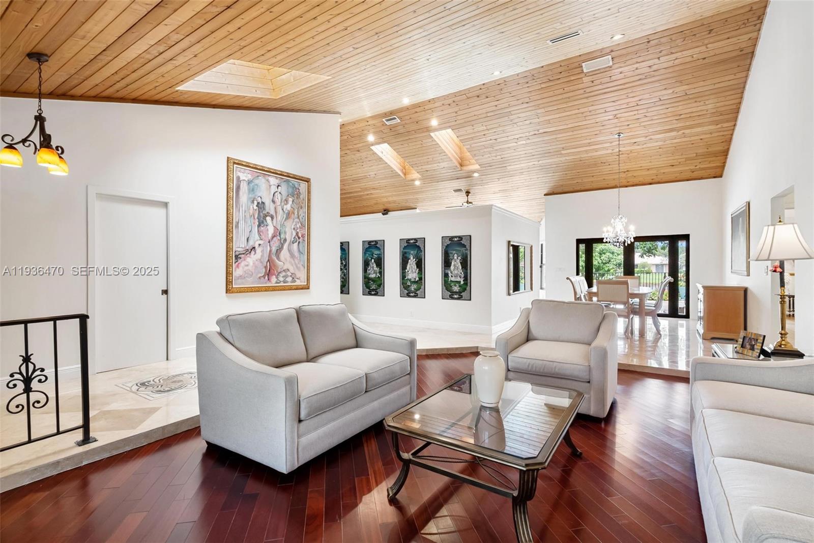 2685 Northwest 27th Terrace Boca Raton, FL 33434 - Photo 2 of 31 a living room with furniture and wooden floor