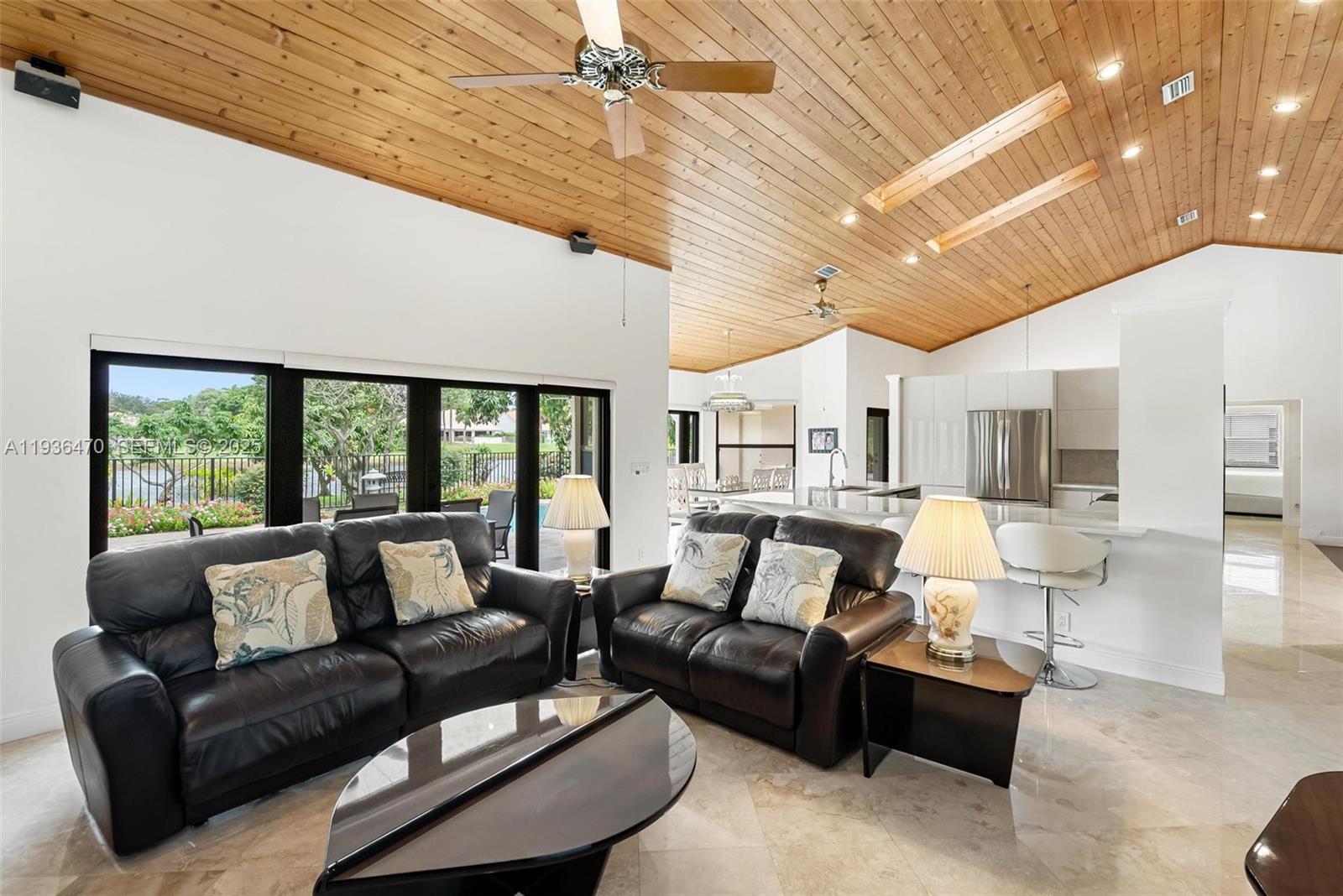 2685 Northwest 27th Terrace Boca Raton, FL 33434 - Photo 21 of 31 a living room with furniture and a large window