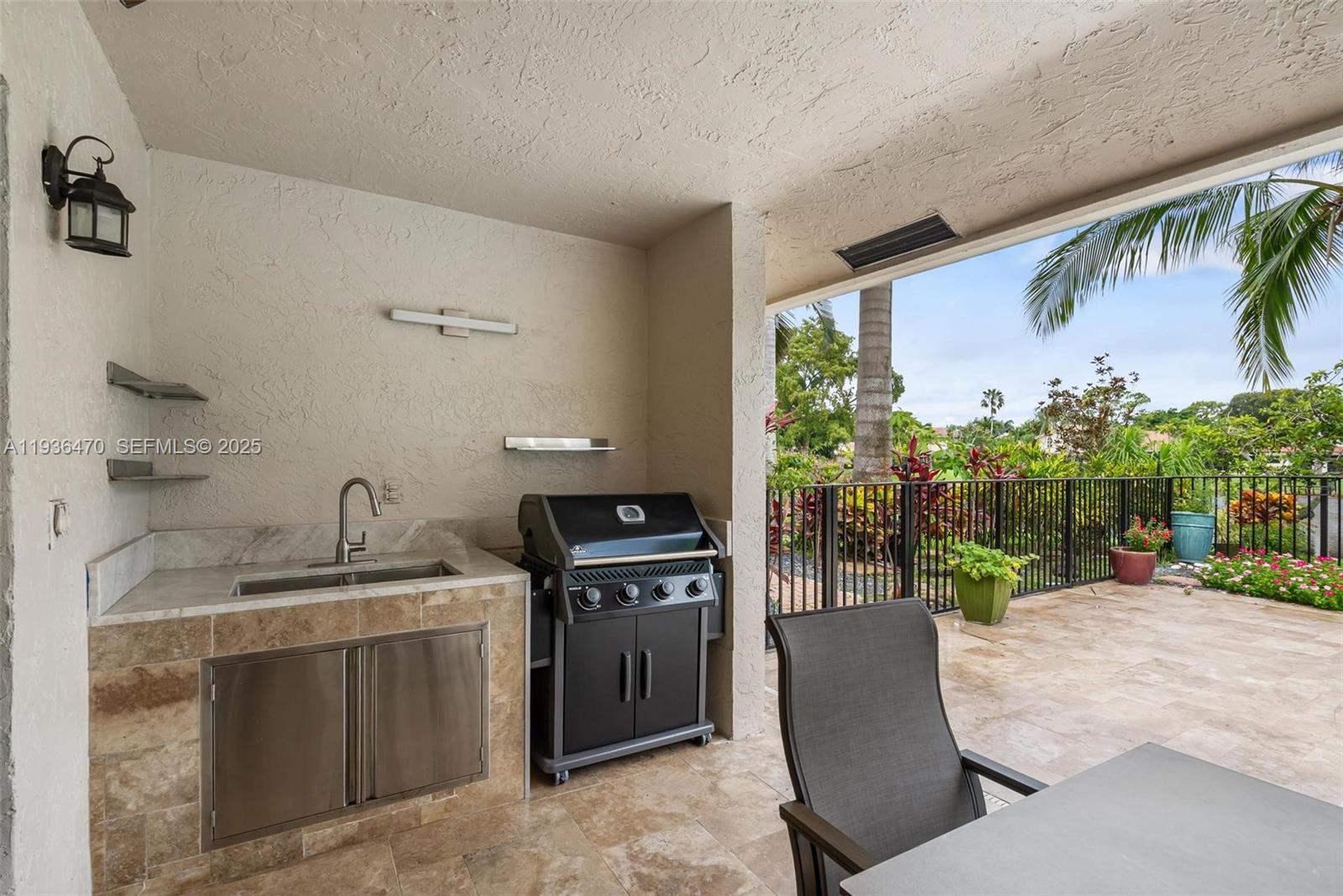 2685 Northwest 27th Terrace Boca Raton, FL 33434 - Photo 24 of 31 a kitchen with a stove a sink and a refrigerator