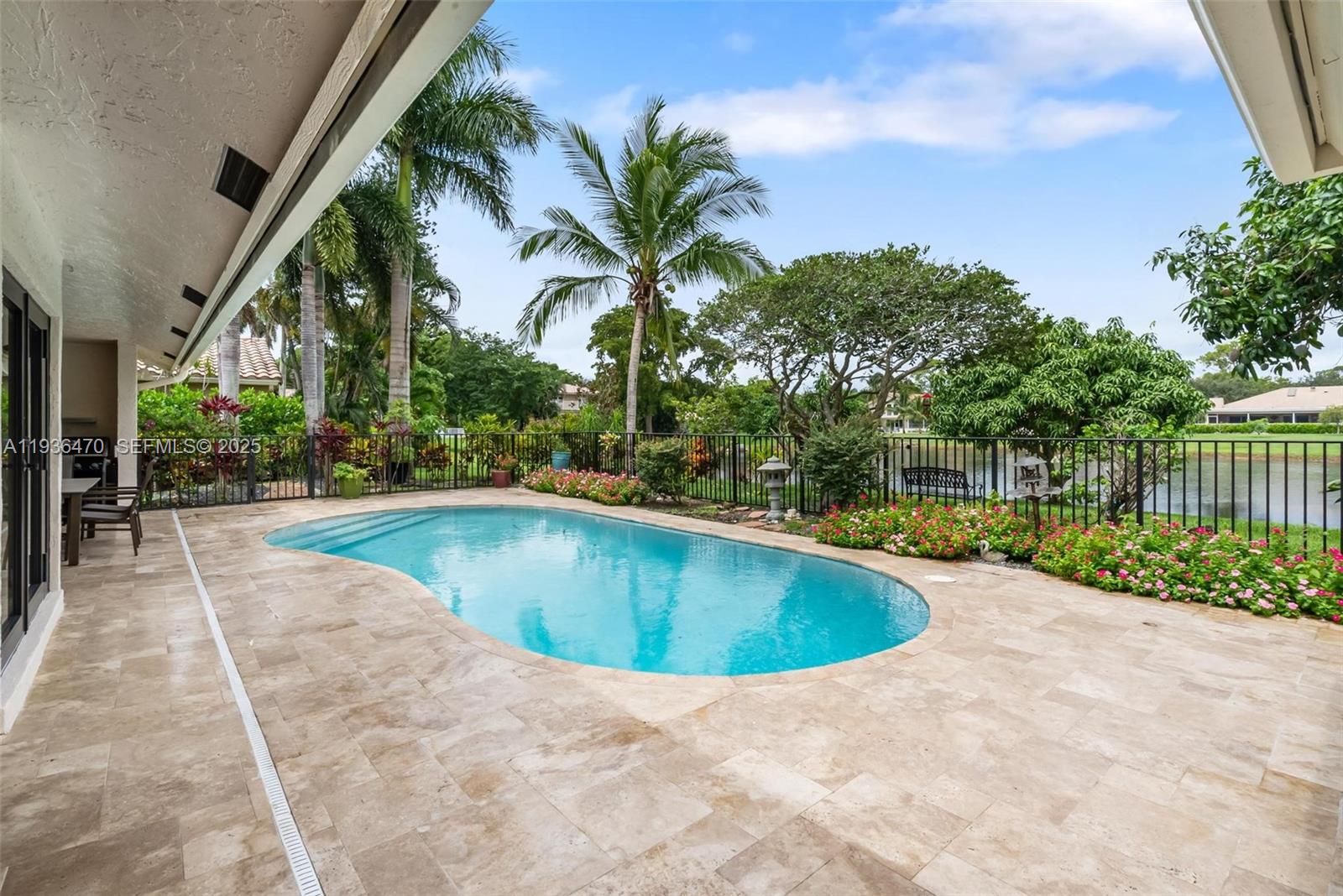 2685 Northwest 27th Terrace Boca Raton, FL 33434 - Photo 25 of 31 a view of outdoor space yard swimming pool and patio