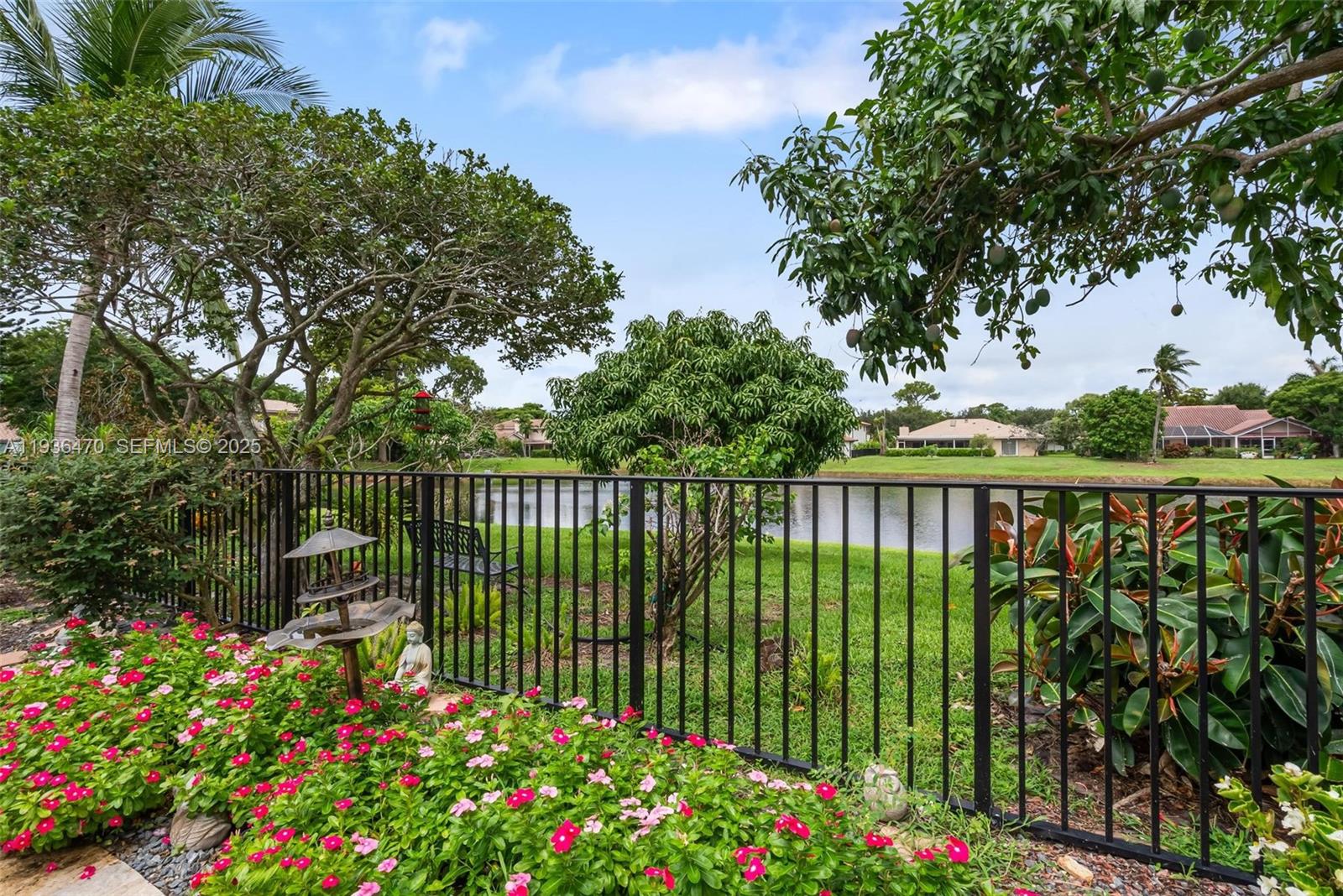 2685 Northwest 27th Terrace Boca Raton, FL 33434 - Photo 30 of 31 a green field with flowers in the background