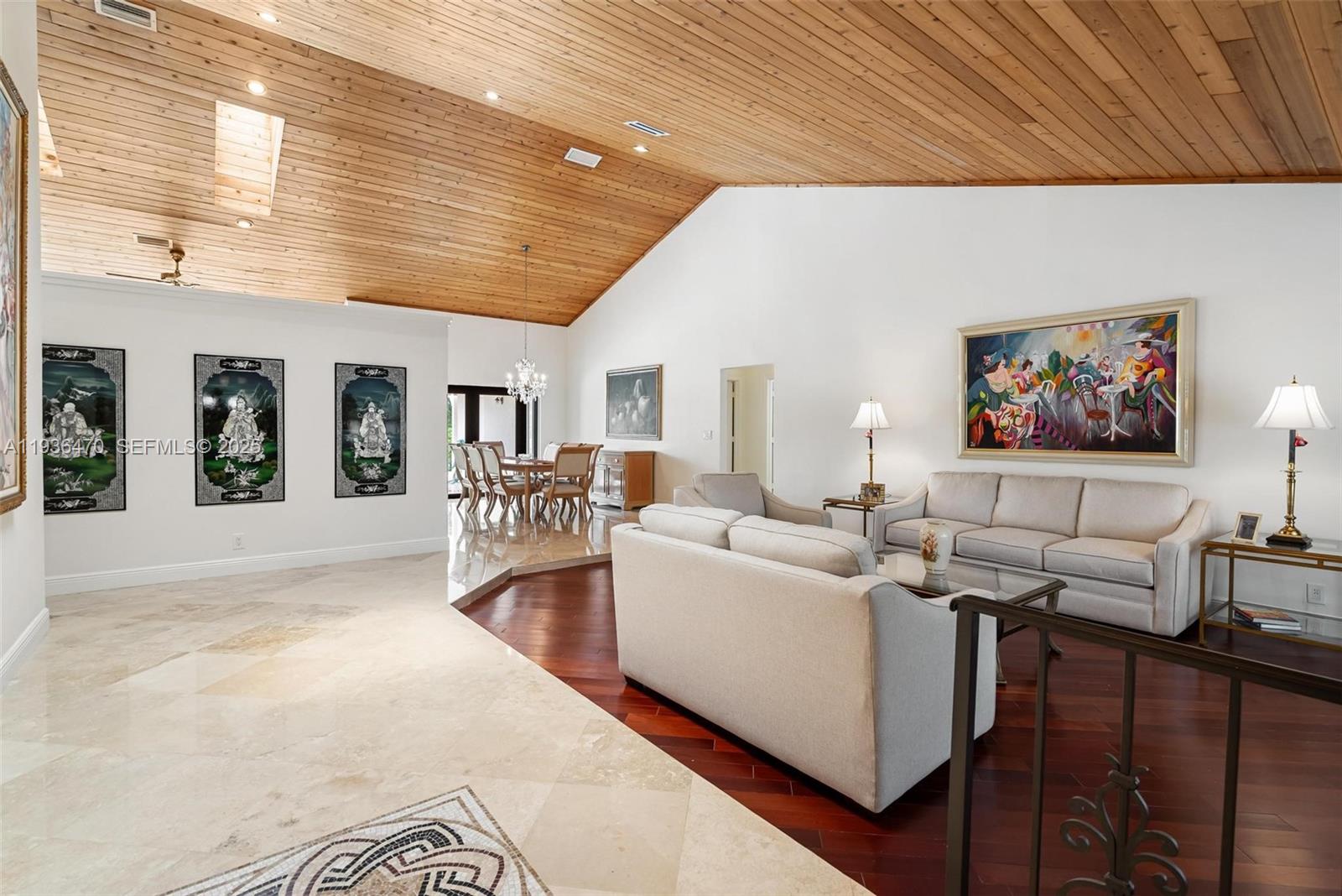 2685 Northwest 27th Terrace Boca Raton, FL 33434 - Photo 3 of 31 a living room with furniture and a flat screen tv