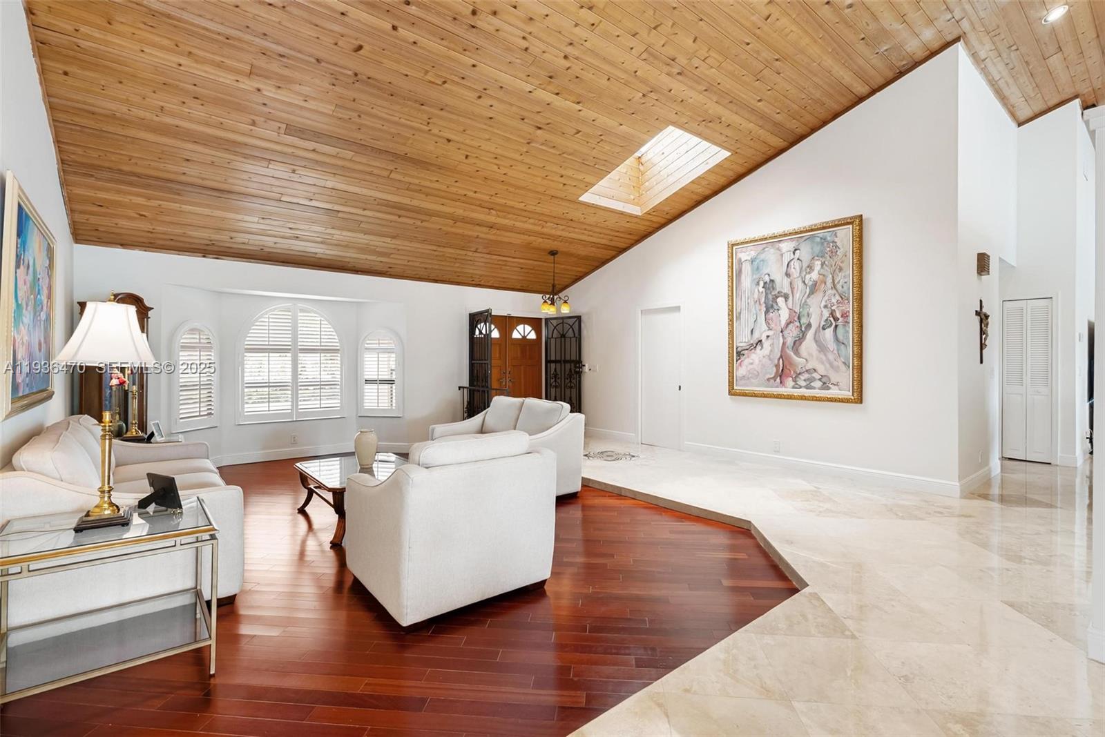 2685 Northwest 27th Terrace Boca Raton, FL 33434 - Photo 4 of 31 a living room with furniture and wooden floor