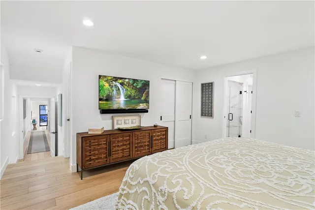 a bathroom with double vanity sinks and a mirror