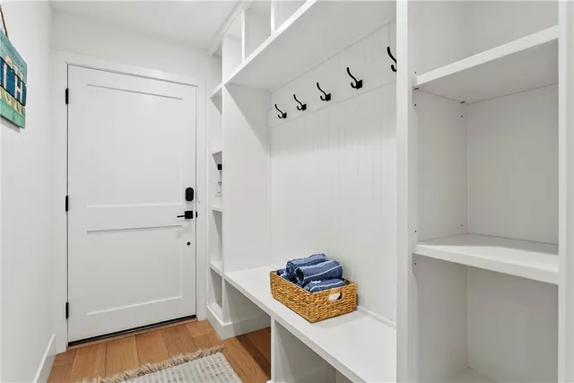 a view of a patio with table and chairs under an umbrella