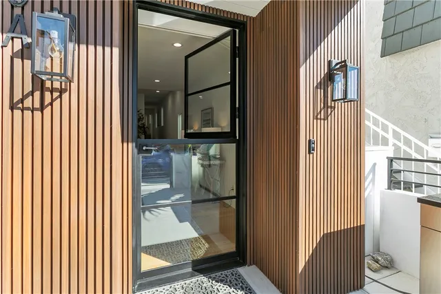 a living room with furniture kitchen view and a table