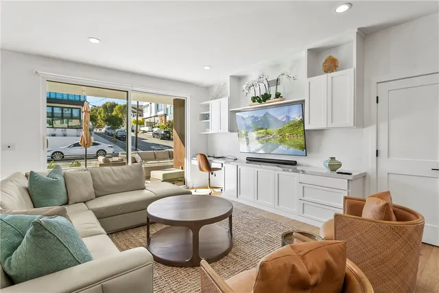 a kitchen with a sink a stove and cabinets