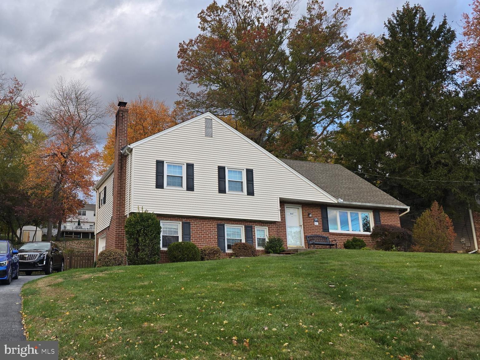617 Meadowlark Road Norristown, PA 19403 - Photo 2 of 20 a front view of a house with a garden and porch