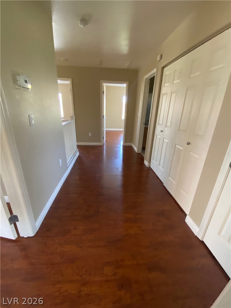 489 Foster Springs Road Las Vegas, NV 89148 - Photo 11 of 30 Rich hardwood flooring guides you through this home's inviting interior hallway.
