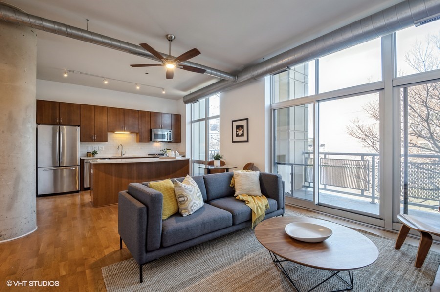 700 North Larrabee Street, Unit 115 Chicago, IL 60654 - Photo 5 of 11 a living room with furniture and a large window