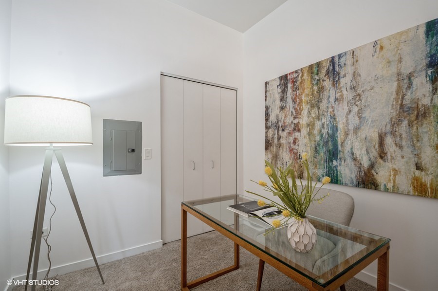 700 North Larrabee Street, Unit 115 Chicago, IL 60654 - Photo 8 of 11 a view of a workspace with furniture and a window