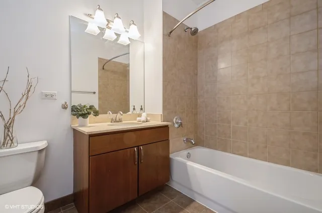 a bathroom with a sink a toilet and a bathtub